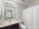 Cozy bathroom featuring a single sink vanity and a shower, designed for comfort and practicality at 3949 Picasso Ct, Charlotte, NC 28205