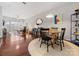 Dining room with hardwood floors, a round table, and contemporary lighting at 3949 Picasso Ct, Charlotte, NC 28205