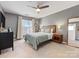 Cozy main bedroom featuring a ceiling fan and two large windows at 3949 Picasso Ct, Charlotte, NC 28205