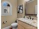 Well-lit powder room features granite countertop, modern fixtures and elegant decor at 462 Barber Loop, Mooresville, NC 28117