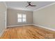 Empty bedroom featuring hardwood floors and a ceiling fan at 462 Barber Loop, Mooresville, NC 28117