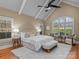 Bright primary bedroom boasts natural light, neutral tones, and vaulted ceiling at 462 Barber Loop, Mooresville, NC 28117