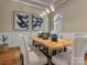 Elegant dining room showcasing wainscoting, a wood table with modern chairs, and pendant lighting at 462 Barber Loop, Mooresville, NC 28117