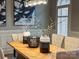 Close-up of dining room table featuring herringbone wood pattern, vases, and pendant lighting at 462 Barber Loop, Mooresville, NC 28117