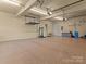 Large garage with epoxy flooring and lots of room for storage and work space at 462 Barber Loop, Mooresville, NC 28117