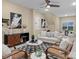 Inviting living room with neutral tones, comfortable seating, and a ceiling fan at 462 Barber Loop, Mooresville, NC 28117