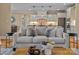 Comfortable living room with a view into the bright kitchen featuring modern stainless appliances at 462 Barber Loop, Mooresville, NC 28117