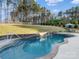 Beautiful in-ground pool with stone accents and waterfall features in a private backyard setting at 462 Barber Loop, Mooresville, NC 28117