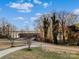 View of a home and landscaped front yard along with a lake view at 462 Barber Loop, Mooresville, NC 28117