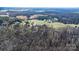 Aerial view of property nestled among trees and greenery at 468 White Oak Branch Rd, Statesville, NC 28625