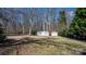 Backyard featuring two sheds, providing additional storage space at 468 White Oak Branch Rd, Statesville, NC 28625