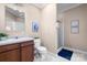 Bathroom with a single sink vanity, toilet, and glass-enclosed shower at 468 White Oak Branch Rd, Statesville, NC 28625