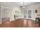 Dining room with hardwood floors, elegant lighting, and access to the patio, perfect for indoor-outdoor living at 468 White Oak Branch Rd, Statesville, NC 28625