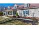 Charming home with a long, covered front porch and manicured landscaping, creating a welcoming curb appeal at 468 White Oak Branch Rd, Statesville, NC 28625