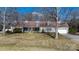 Charming single-Gathering home featuring a long, covered front porch and an attached two-car garage at 468 White Oak Branch Rd, Statesville, NC 28625