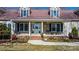 Inviting front porch with seating, featuring a charming entryway and enhancing the home's curb appeal at 468 White Oak Branch Rd, Statesville, NC 28625