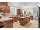 Well-lit kitchen with wood cabinets, an island, and an open layout, offering a modern and functional cooking space at 468 White Oak Branch Rd, Statesville, NC 28625