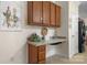 Kitchen area with wooden cabinetry, countertop space and decor, with white door at 468 White Oak Branch Rd, Statesville, NC 28625