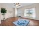 Bright living room with hardwood floors, a large window, and a stylish area rug, creating a welcoming atmosphere at 468 White Oak Branch Rd, Statesville, NC 28625