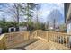 This home includes a spacious wooden deck with railing, perfect for outdoor entertaining and relaxing at 523 Hickory Nut Ln, China Grove, NC 28023
