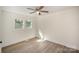 Bright bedroom with wood floors, light walls, and a ceiling fan for added comfort and style at 523 Hickory Nut Ln, China Grove, NC 28023