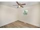 A light and airy bedroom featuring wood-look floors and a contemporary ceiling fan for enhanced comfort at 523 Hickory Nut Ln, China Grove, NC 28023