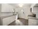 Kitchen featuring granite countertops, stainless steel appliances, white subway tile, and wood flooring at 523 Hickory Nut Ln, China Grove, NC 28023
