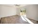 Bright living room featuring neutral paint, sliding glass doors to the deck, and new wood flooring at 523 Hickory Nut Ln, China Grove, NC 28023