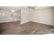 Spacious, bright living room featuring new wood flooring, neutral paint, and lots of natural light at 523 Hickory Nut Ln, China Grove, NC 28023
