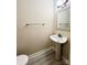 Simple bathroom with a pedestal sink and modern fixtures at 5810 Hunting Ridge Ln # C, Charlotte, NC 28212