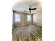 Bright bedroom featuring two windows, neutral paint and a ceiling fan at 5810 Hunting Ridge Ln # C, Charlotte, NC 28212
