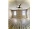 Spacious bedroom with natural light, a ceiling fan, and ample closet space at 5810 Hunting Ridge Ln # C, Charlotte, NC 28212