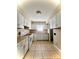 Classic kitchen featuring white appliances and neutral toned floor tiles at 5810 Hunting Ridge Ln # C, Charlotte, NC 28212