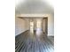 Open-concept living room with staircase access and plenty of natural light at 5810 Hunting Ridge Ln # C, Charlotte, NC 28212