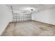 A garage with a large door and concrete floors at 6623 Latherton Ln, Charlotte, NC 28278