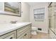 Tastefully updated bathroom with vanity, marble countertop and tiled shower at 7141 Lancer Dr, Charlotte, NC 28226