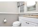 Well-lit bathroom featuring marble countertop vanity, toilet, and framed mirror, with soft, neutral paint at 7141 Lancer Dr, Charlotte, NC 28226