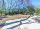 A large, open backyard with a patio and privacy fence at 8208 Doverdale Ln, Charlotte, NC 28217