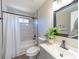 Updated bathroom featuring modern fixtures, a tiled shower, and a sleek vanity with clean lines at 8208 Doverdale Ln, Charlotte, NC 28217