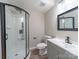 Bathroom with a shower, vanity, tile floors, modern finishes, and excellent lighting at 8208 Doverdale Ln, Charlotte, NC 28217