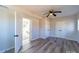 A modern bedroom featuring hardwood floors, neutral paint, recessed lighting, closet space, and doorways at 8208 Doverdale Ln, Charlotte, NC 28217