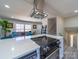 Modern open-concept kitchen with stainless steel appliances, a range hood, and easy access to the living area at 8208 Doverdale Ln, Charlotte, NC 28217