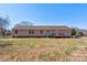 Back exterior of the house with a yard and small deck at 828 Carver St, Shelby, NC 28152