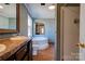 Bathroom featuring double sinks, a soaking tub, and separate shower at 828 Carver St, Shelby, NC 28152