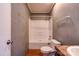 Bathroom featuring a shower and tub combo, toilet, and vanity with wood-look flooring at 828 Carver St, Shelby, NC 28152