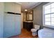 Bathroom featuring double vanity, tub, and toilet at 828 Carver St, Shelby, NC 28152