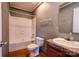 Bathroom featuring a shower and tub combo, toilet, and vanity with wood-look flooring at 828 Carver St, Shelby, NC 28152
