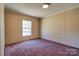 Bedroom featuring a window for natural light and neutral walls and carpets at 828 Carver St, Shelby, NC 28152