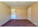 Empty bedroom with neutral walls, doors, and carpeted floor at 828 Carver St, Shelby, NC 28152