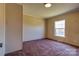 Bedroom featuring a window for natural light and neutral walls and carpets at 828 Carver St, Shelby, NC 28152